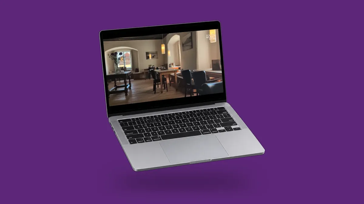Die Website Schloss Neuburg auf einem Laptop